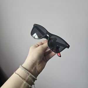Stylish Black Sunglasses with Red Accents